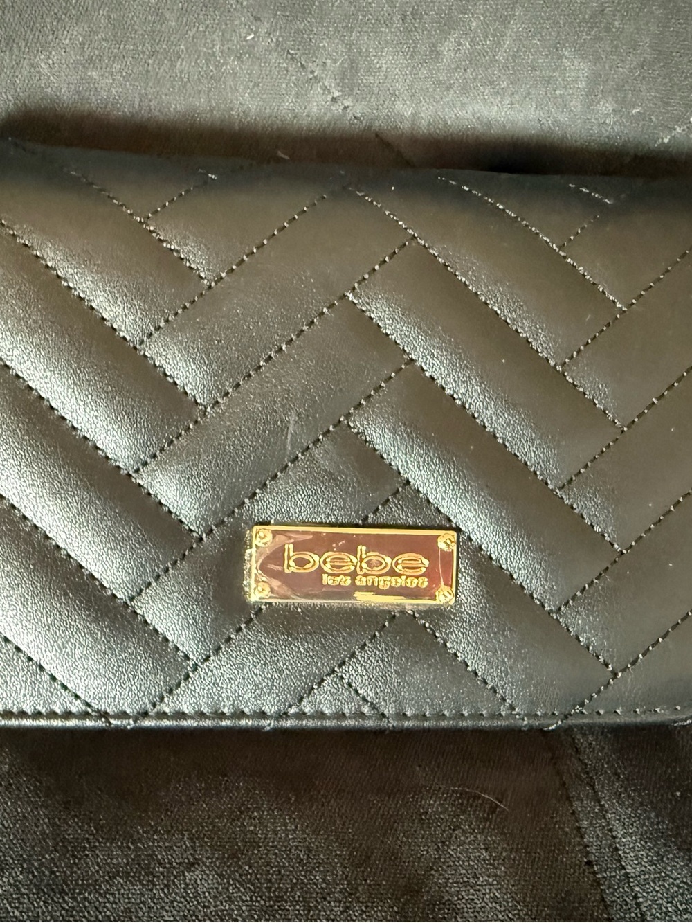 bebe Black Quilted Leather purse with Gold Chain Accent
